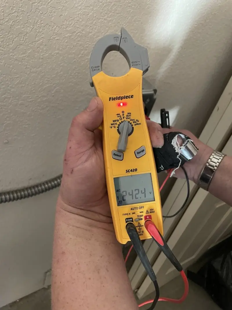 Voltage testing with clamp meter during Electrical Installation Services in Emeryville
